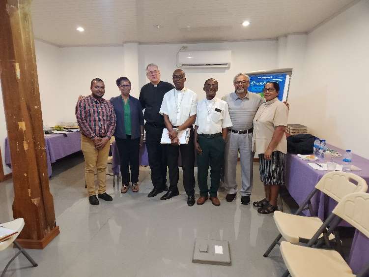 (L-R) Rev Christopher Wordsworth, Rev. Sandra Kurtzious, Rev Peter Kuhnert,
Rev. Leroy Nicholson, Rev. James P. Jones, Rev. Philip Mathai and Rev.
Amanda Singh.
The retreats were held at the Lay Academy, in New
Amsterdam, approximately 70 miles from the capital city,
Georgetown. Advance readings were sent out to all retreat
participants which formed the basis for conversations and
discussions. The retreats focussed on a variety of aspects of
ministry and call, including how a pastor/deacon can be a
living, if broken, symbol of grace. Discussions centred on
pastoral duties and responsibilities, parish organization and
administration, communication, priority setting, and
visioning. Further discussions were held on healthy
boundaries and better self-care of the leaders - about the
physical and mental wellbeing of leaders and their
importance in being able to serve at one’s very best.
Sessions began and ended each day with worship which also
provided opportunities of mutual learning, whether it was a
new song or a new liturgy, or new worship rituals such as the
washing of feet.
The two retreats were exceptional times of mutual learning
and encouragement. The commitment and passion of the
clergy and deacons are to be commended. Their openness
and willingness to learn were very evident as they welcomed
the opportunity to come together and discuss freely with
each other and the facilitators about their challenges and
frustrations but also their joys and hopes. It was edifying to
hear of their joys and frustrations and how they faced
challenges in their own contexts.
